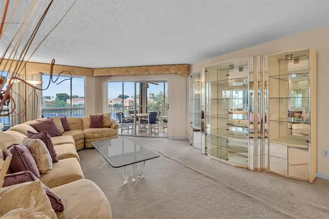 a spacious bedroom with a bed and large window