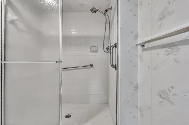 a bedroom with a bed window and couch