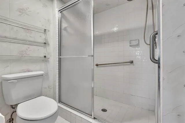 a bathroom with a sink double vanity and a mirror