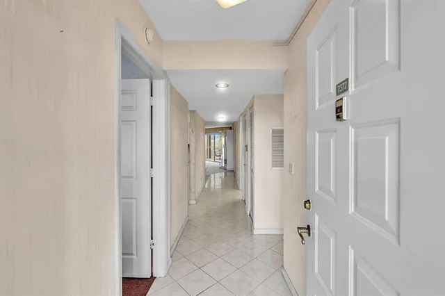 a kitchen with granite countertop a sink stainless steel appliances and cabinets