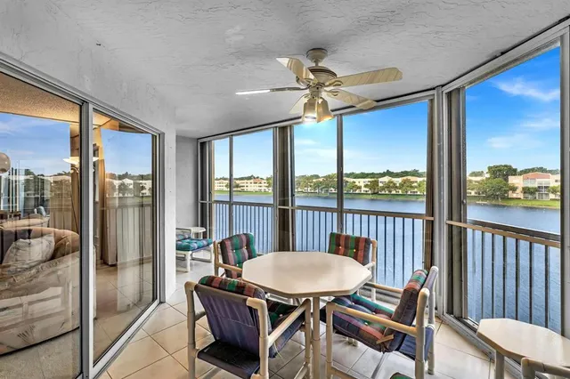 an aerial view of residential houses with outdoor space and street view
