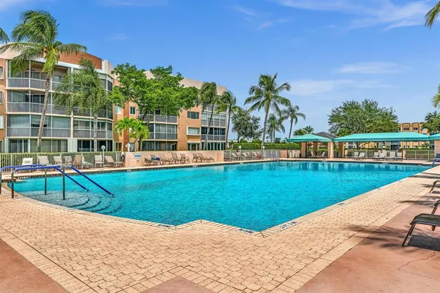 an aerial view of residential houses with outdoor space and street view
