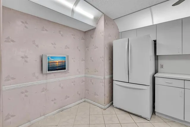 a view of a hallway with wooden shelves