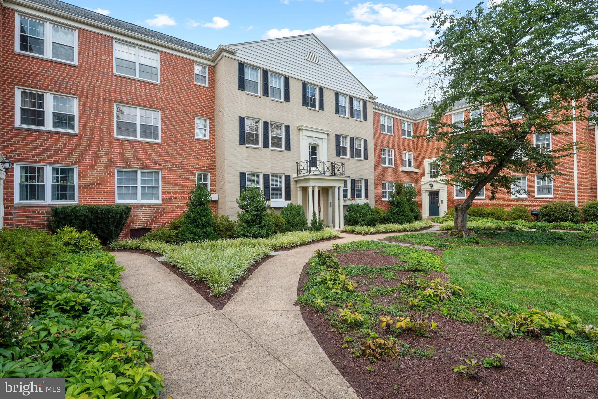 1302 Belle View Boulevard, Unit A1 Alexandria, VA 22307 - Photo 26 of 26 Charming brick apartment with lush landscaping.