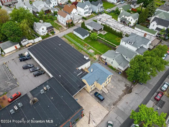 an aerial view of a house with a garden