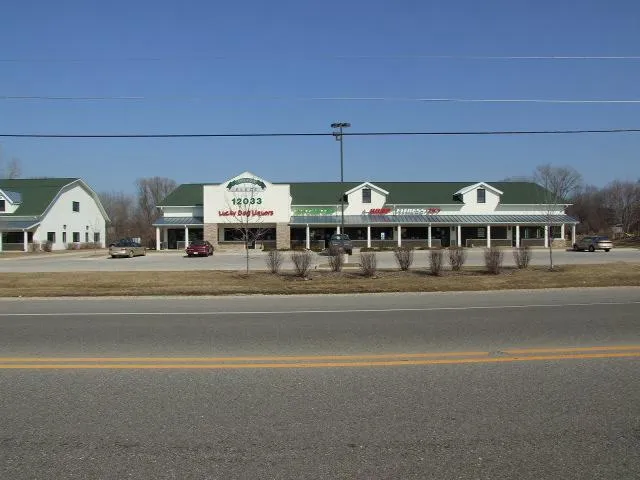 a view of building with a lot of car parked