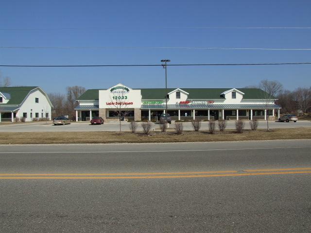 a view of building with a lot of car parked