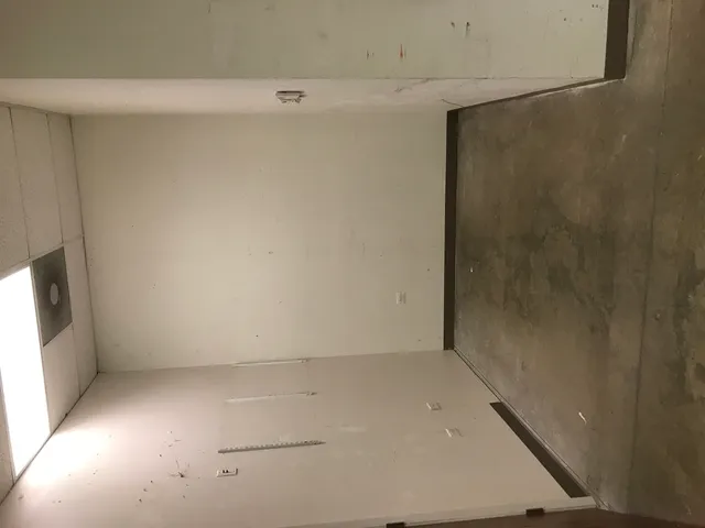 an empty room with windows