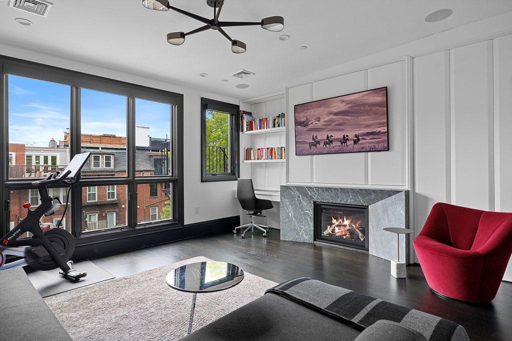8 Rutland Square, Unit 2 Boston, MA 02118 - Photo 24 of 30 a living room with furniture and a fireplace