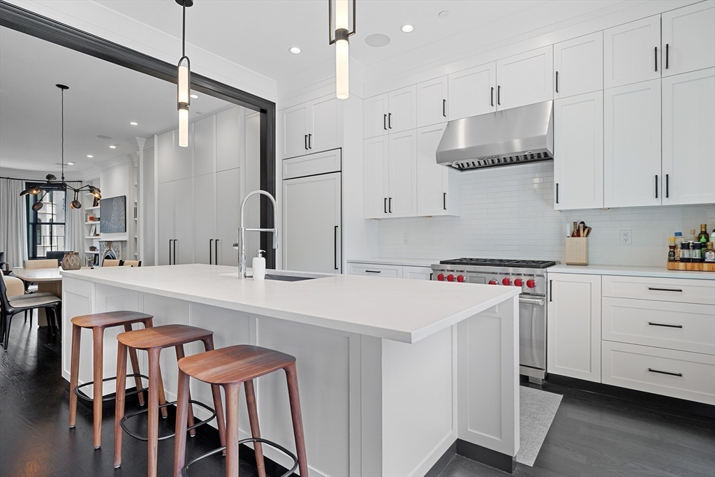 8 Rutland Square, Unit 2 Boston, MA 02118 - Photo 8 of 30 a kitchen that has a lot of cabinets in it and appliances