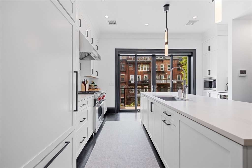 8 Rutland Square, Unit 2 Boston, MA 02118 - Photo 9 of 30 a kitchen with a sink and a wooden floor