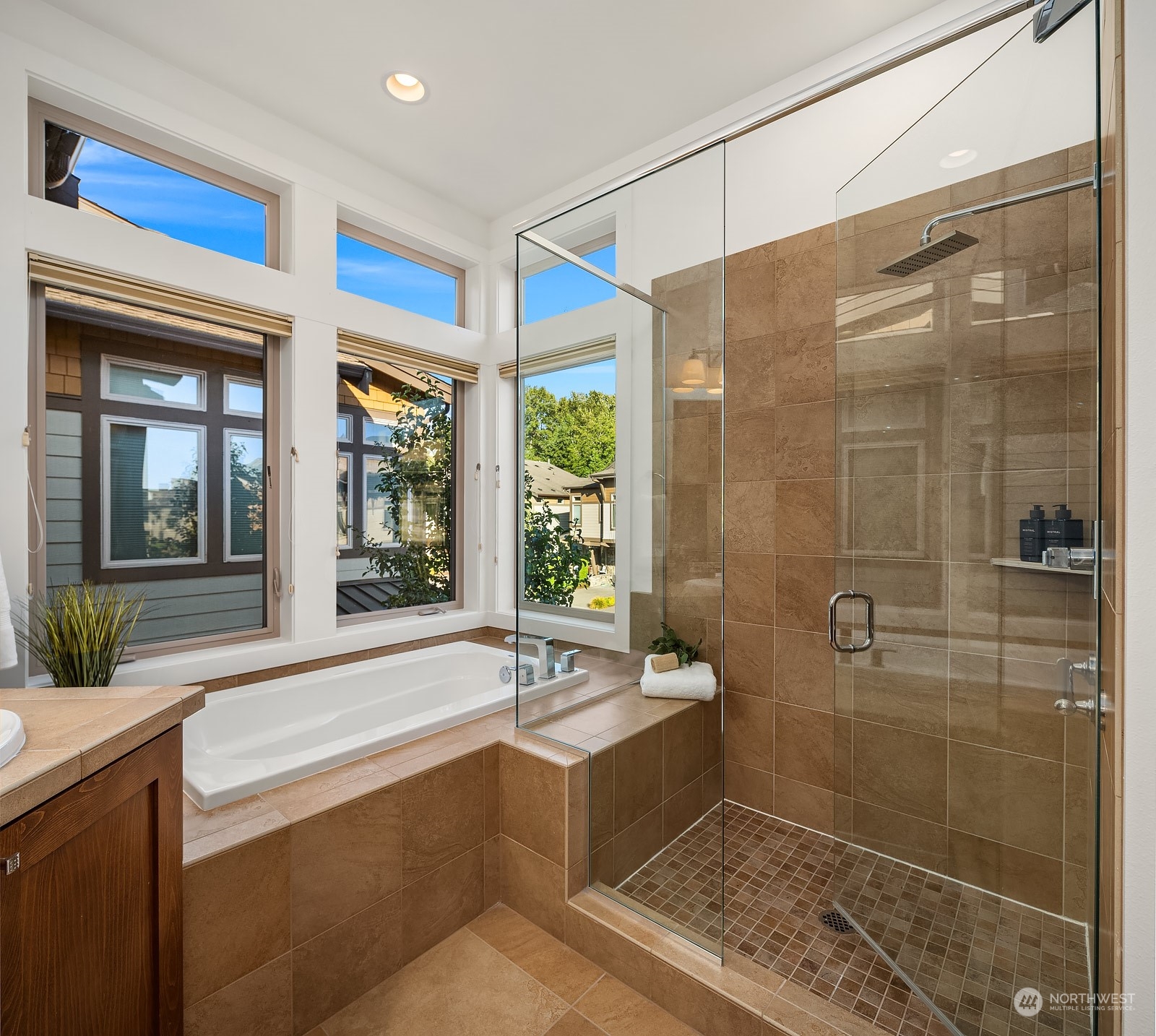 1104 North 41st Place Renton, WA 98056 - Photo 20 of 40 a bathroom with a large tub and shower