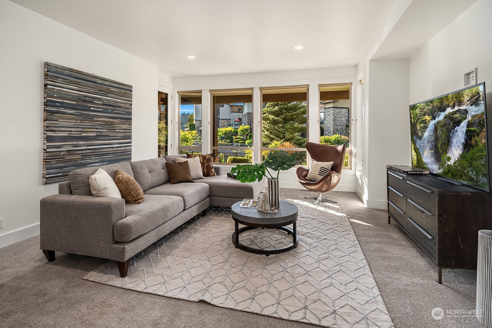 1104 North 41st Place Renton, WA 98056 - Photo 25 of 40 a living room with furniture and a flat screen tv