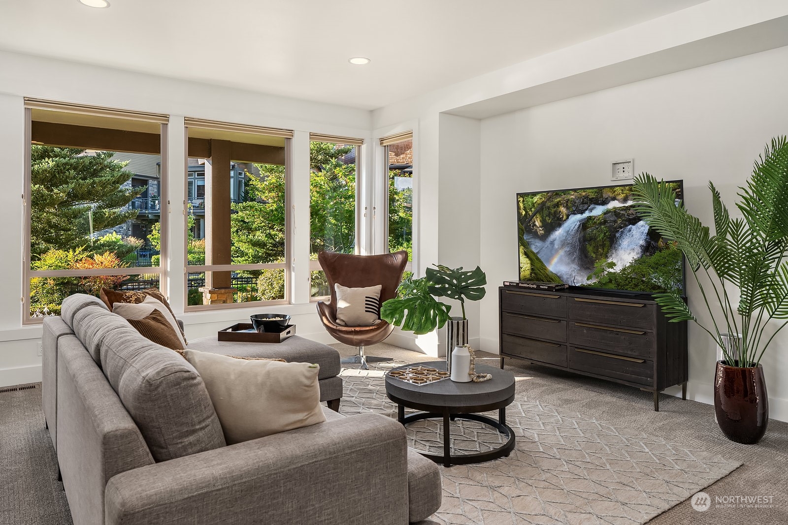 1104 North 41st Place Renton, WA 98056 - Photo 26 of 40 a living room with furniture and a flat screen tv