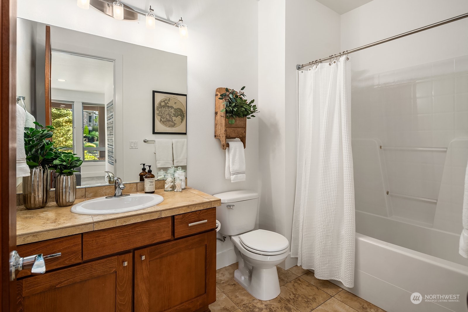 1104 North 41st Place Renton, WA 98056 - Photo 28 of 40 a bathroom with a sink a toilet and shower