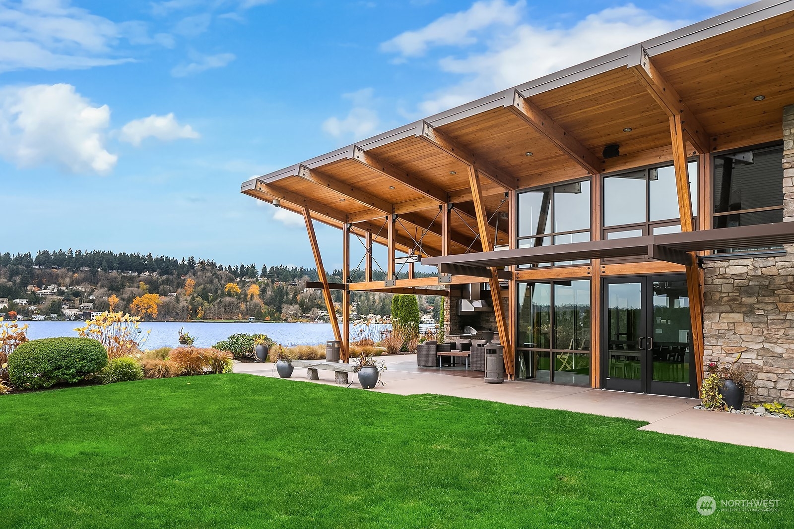 1104 North 41st Place Renton, WA 98056 - Photo 35 of 40 a view of a patio with a table and chairs under an umbrella
