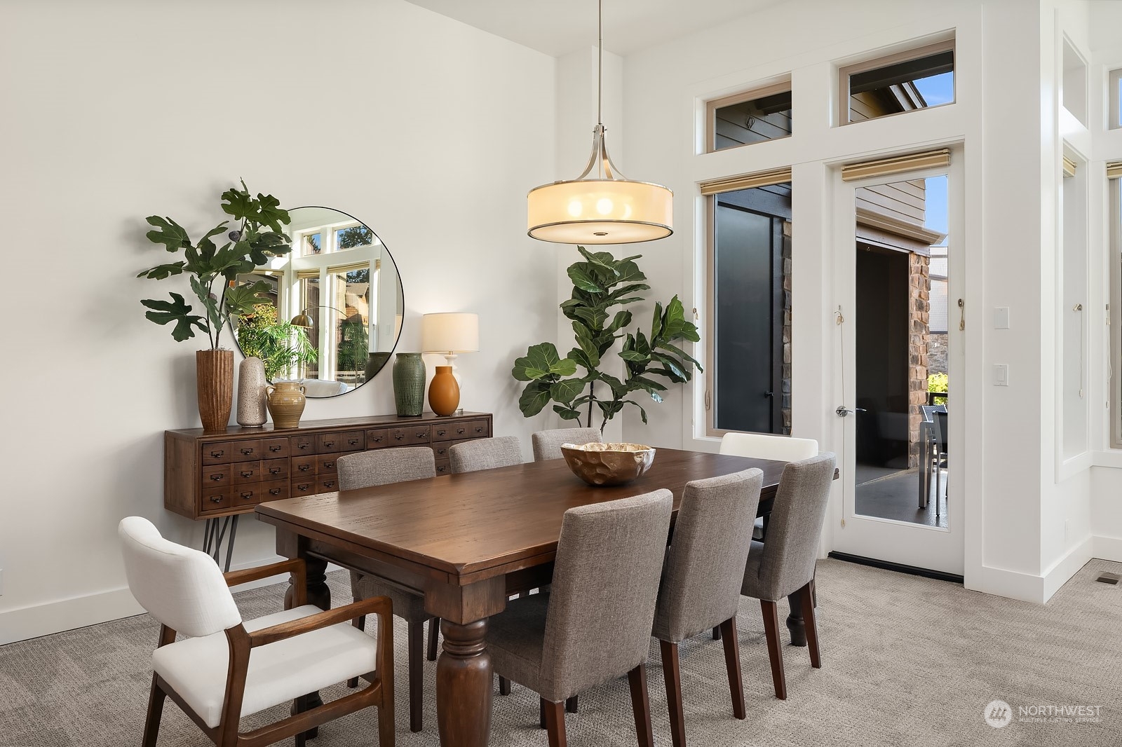 1104 North 41st Place Renton, WA 98056 - Photo 8 of 40 a dining room with furniture and a chandelier