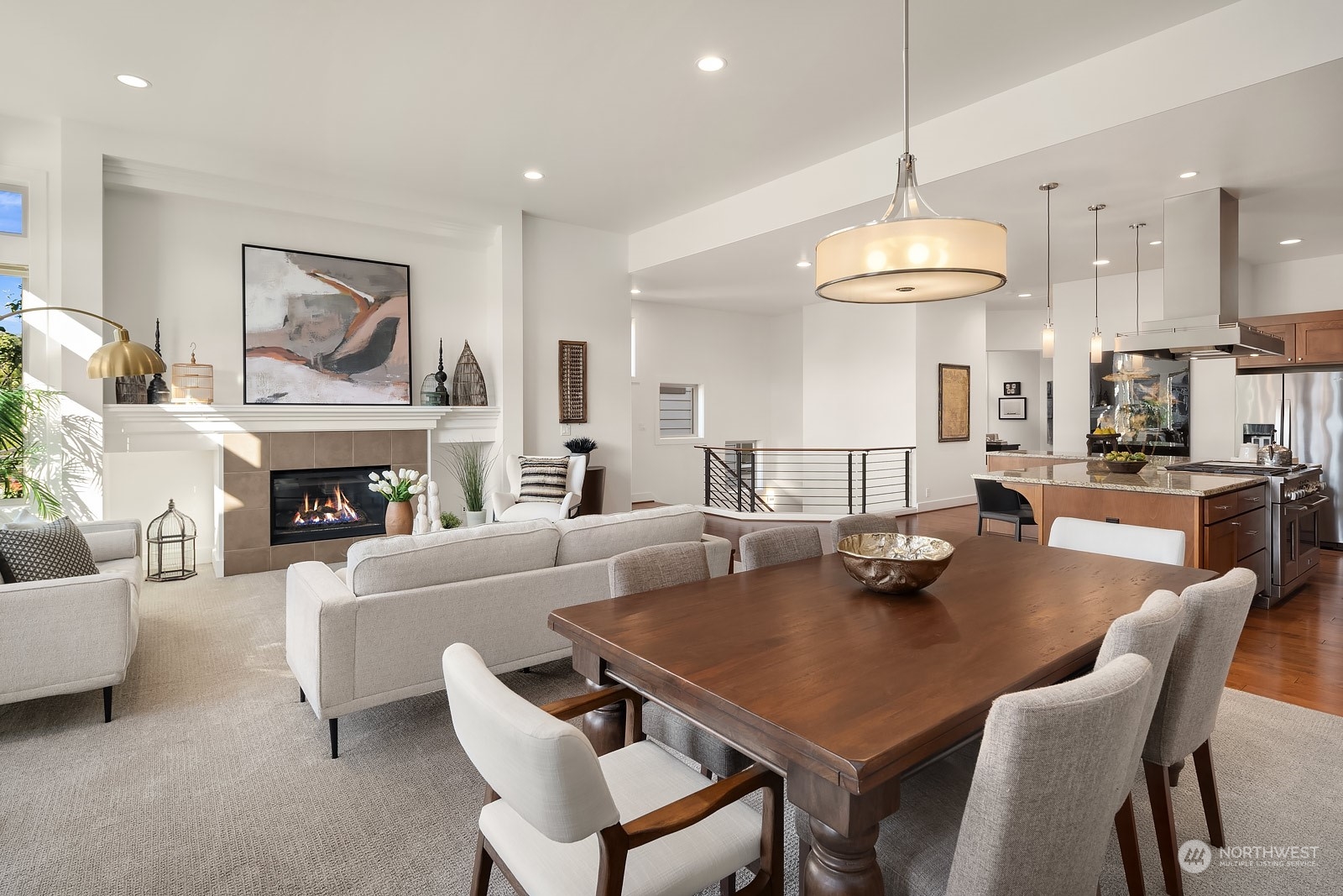 1104 North 41st Place Renton, WA 98056 - Photo 10 of 40 a living room with fireplace furniture and a chandelier