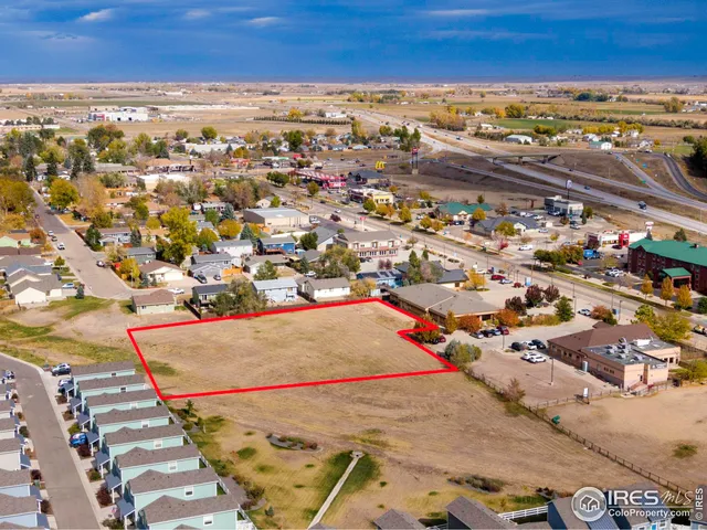 an aerial view of residential building and ocean view