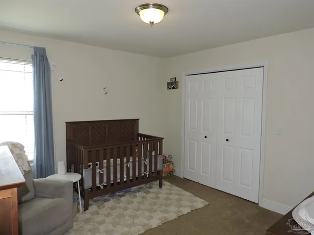 a view of a livingroom with furniture and entryway
