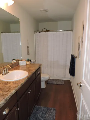 a view of a patio with table and chairs