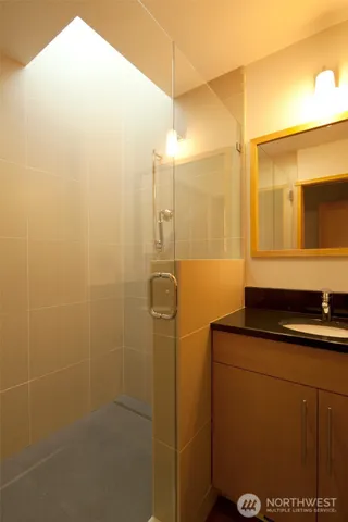 a bathroom with a sink and mirror