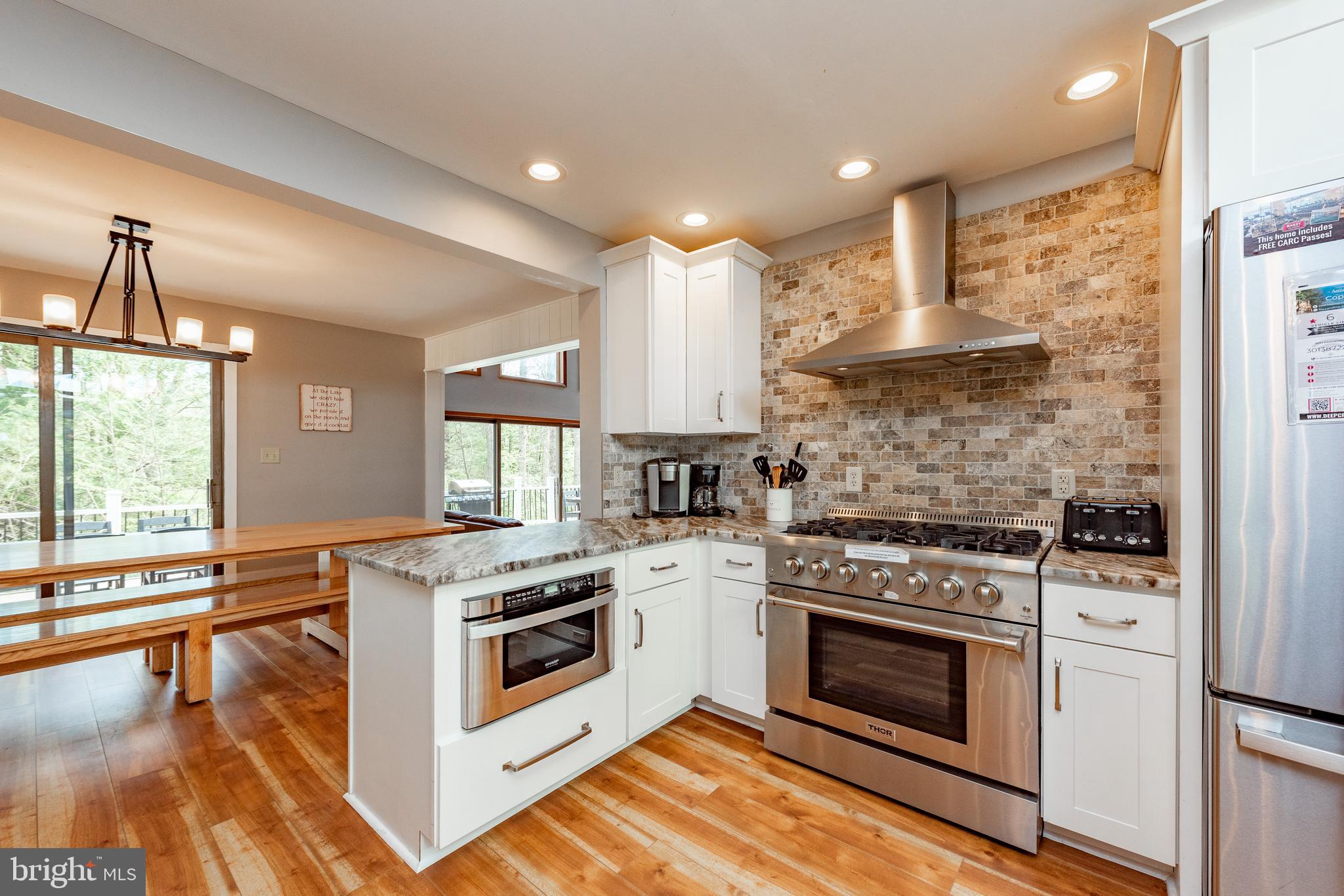 2463 Mayhew Inn Road Oakland, MD 21550 - Photo 11 of 144 a kitchen with a stove a sink and a refrigerator