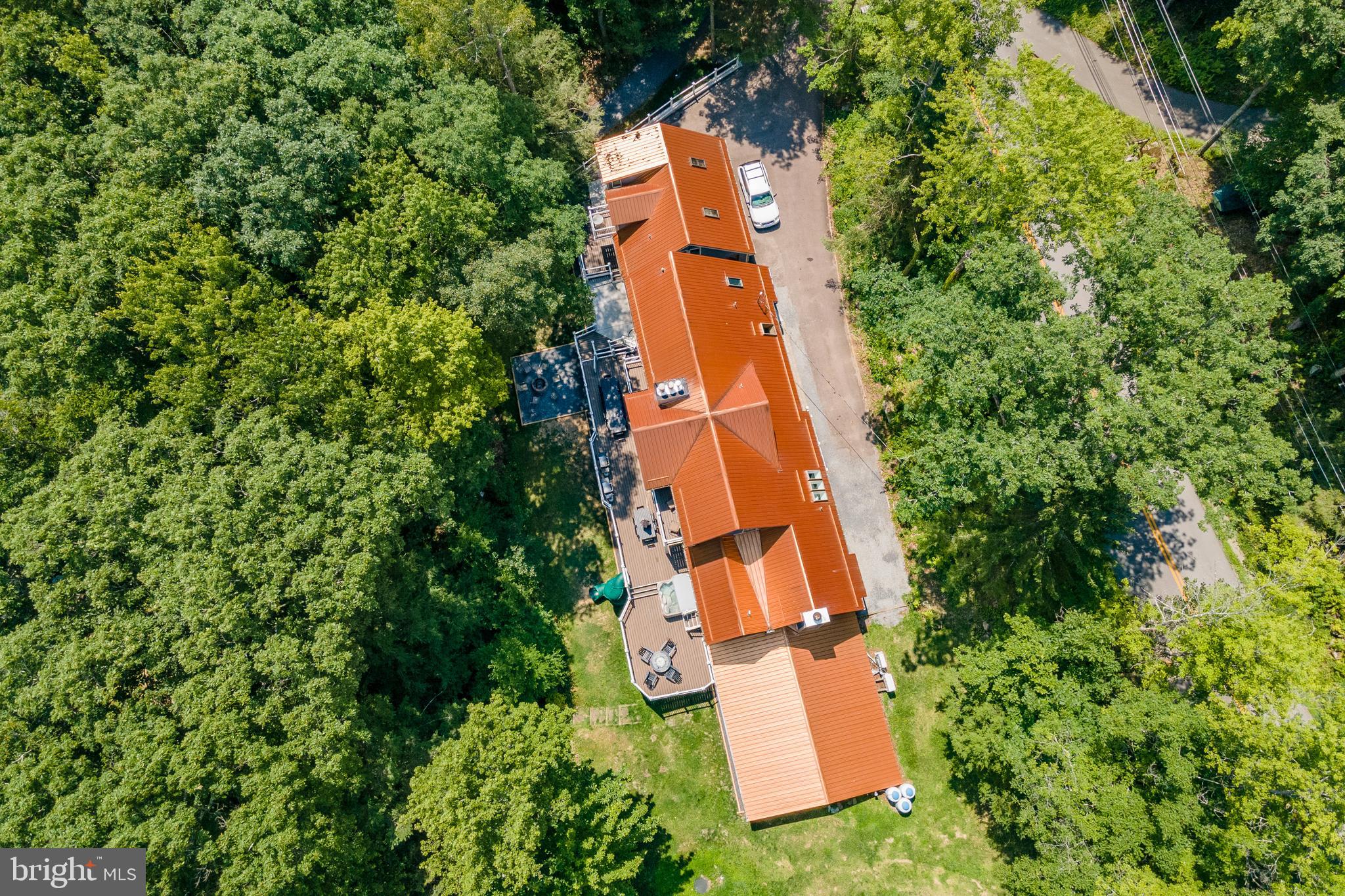 2463 Mayhew Inn Road Oakland, MD 21550 - Photo 119 of 144 an aerial view of a house with a yard and trees