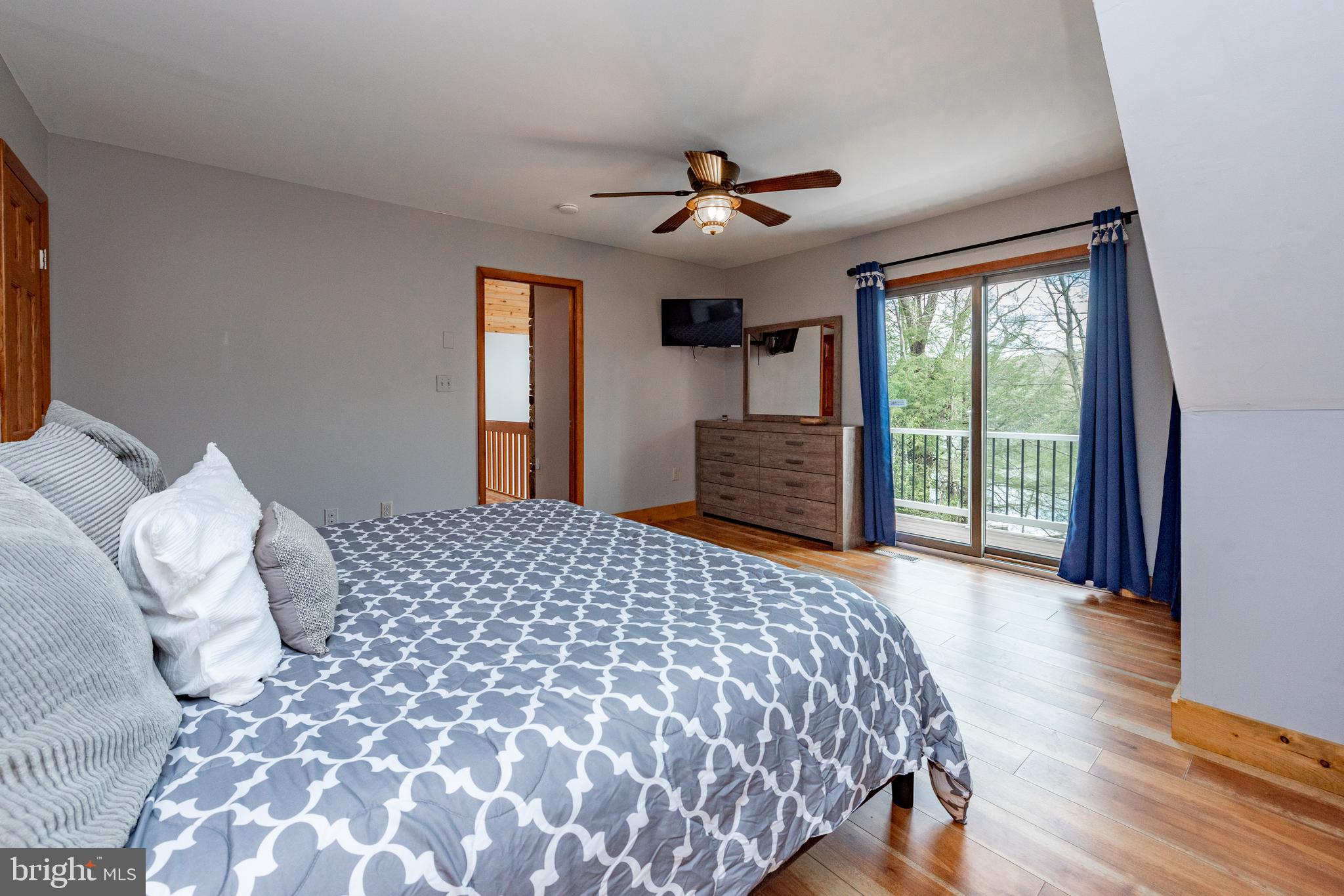 2463 Mayhew Inn Road Oakland, MD 21550 - Photo 51 of 144 a bedroom with a large bed and a large window