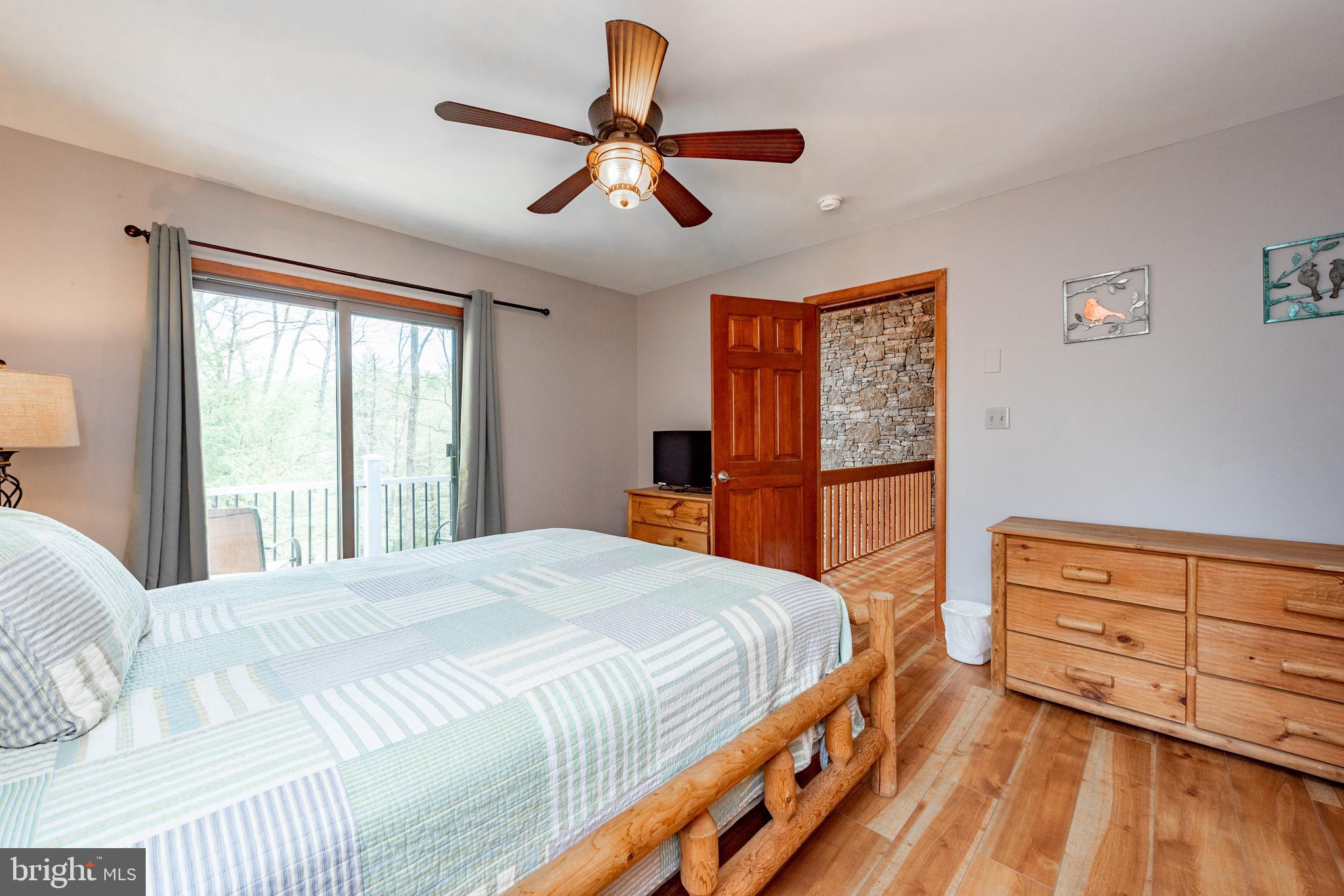 2463 Mayhew Inn Road Oakland, MD 21550 - Photo 59 of 144 a bedroom with a large bed and a window