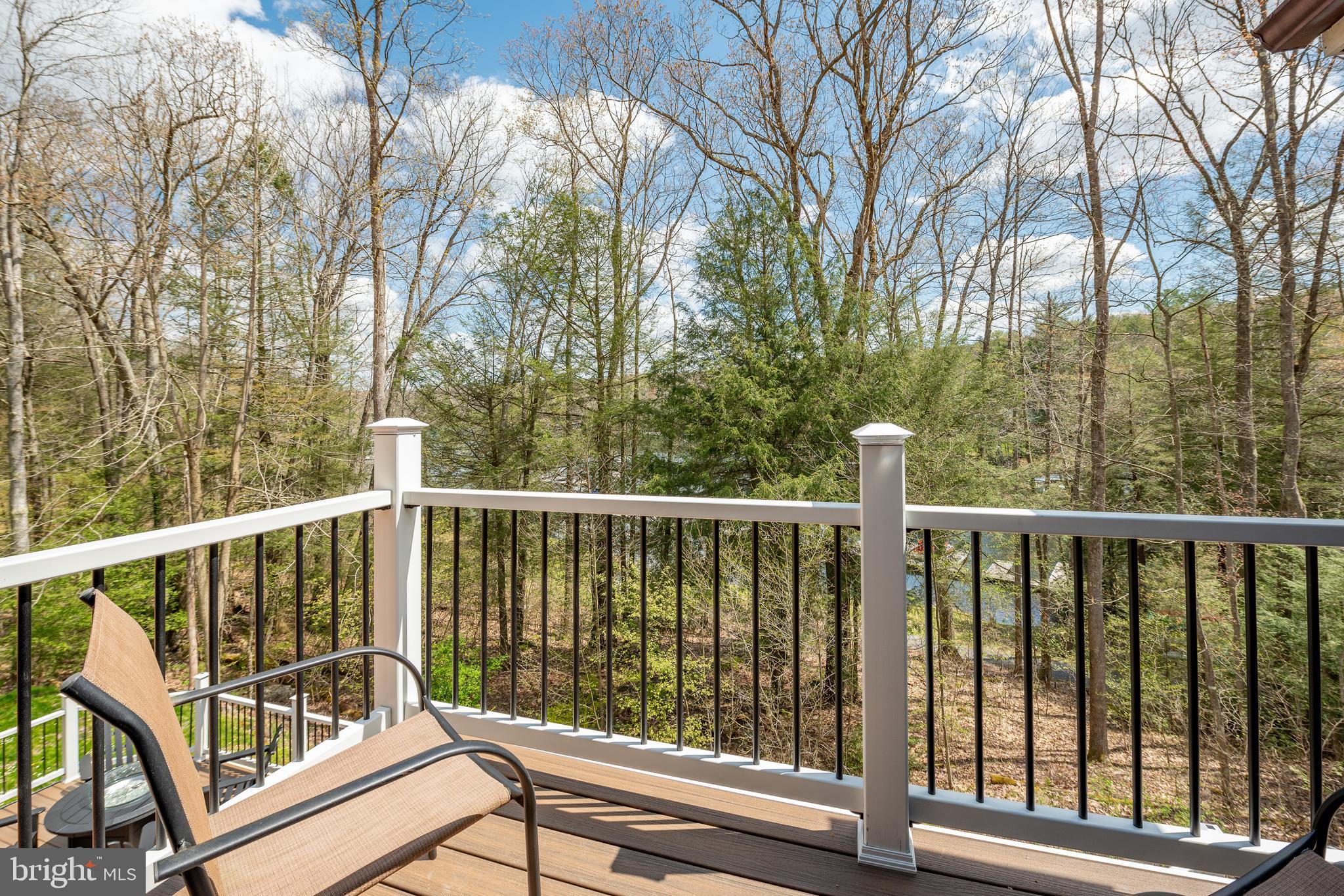 2463 Mayhew Inn Road Oakland, MD 21550 - Photo 61 of 144 a view of a balcony with wooden floor and fence