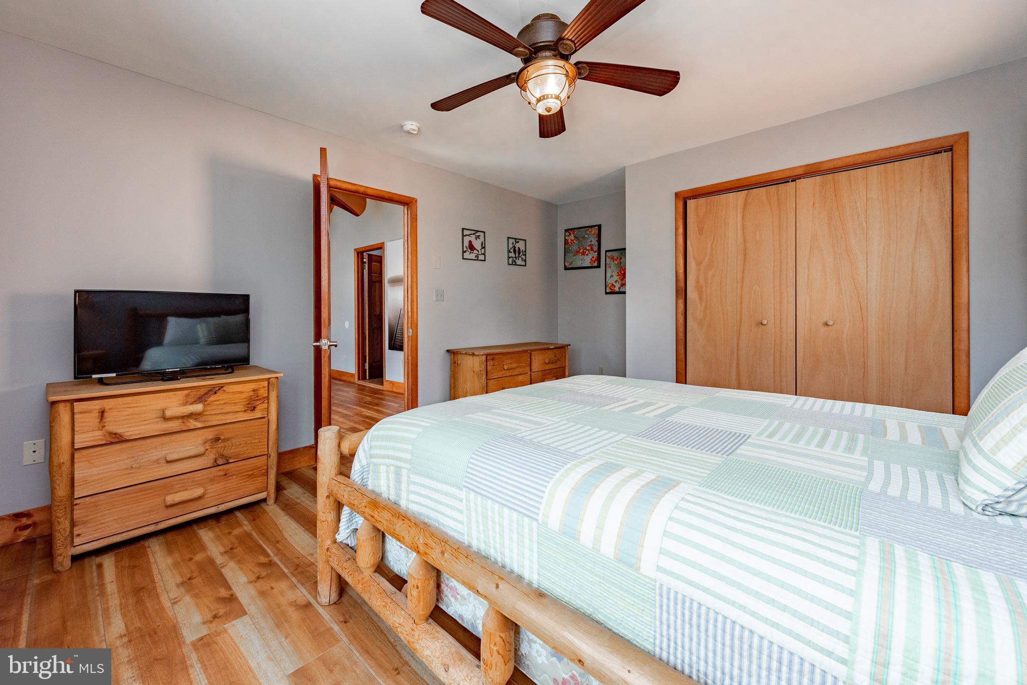 2463 Mayhew Inn Road Oakland, MD 21550 - Photo 62 of 144 a bedroom with a bed and wooden floor
