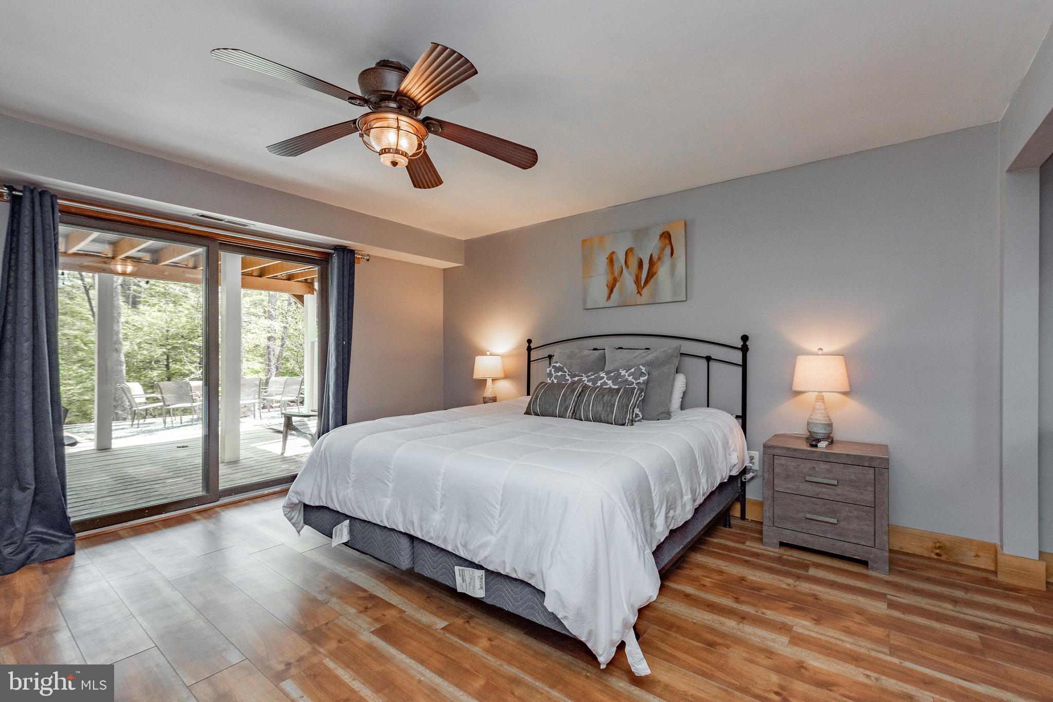 2463 Mayhew Inn Road Oakland, MD 21550 - Photo 68 of 144 a bedroom with a large bed and a large window
