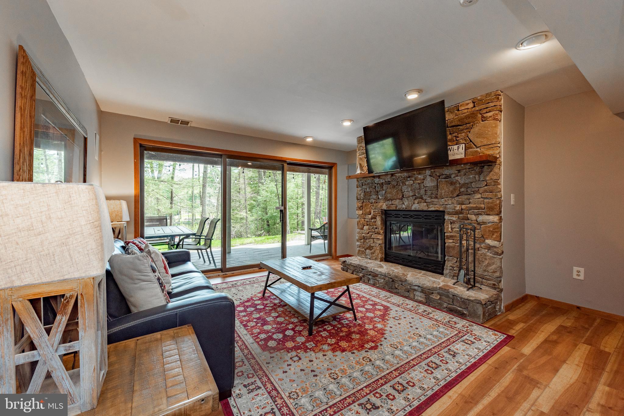 2463 Mayhew Inn Road Oakland, MD 21550 - Photo 75 of 144 a living room with furniture and a fireplace