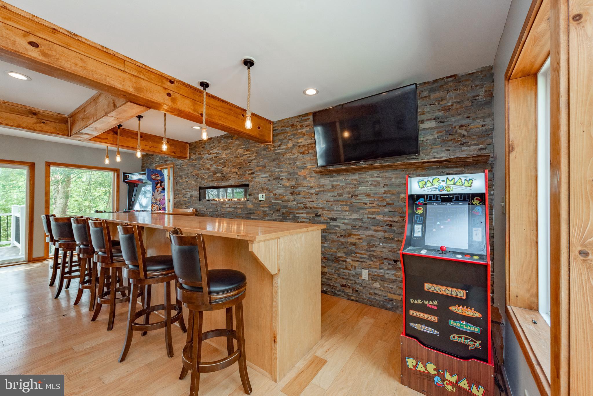 2463 Mayhew Inn Road Oakland, MD 21550 - Photo 87 of 144 a dining room with furniture and a flat screen tv