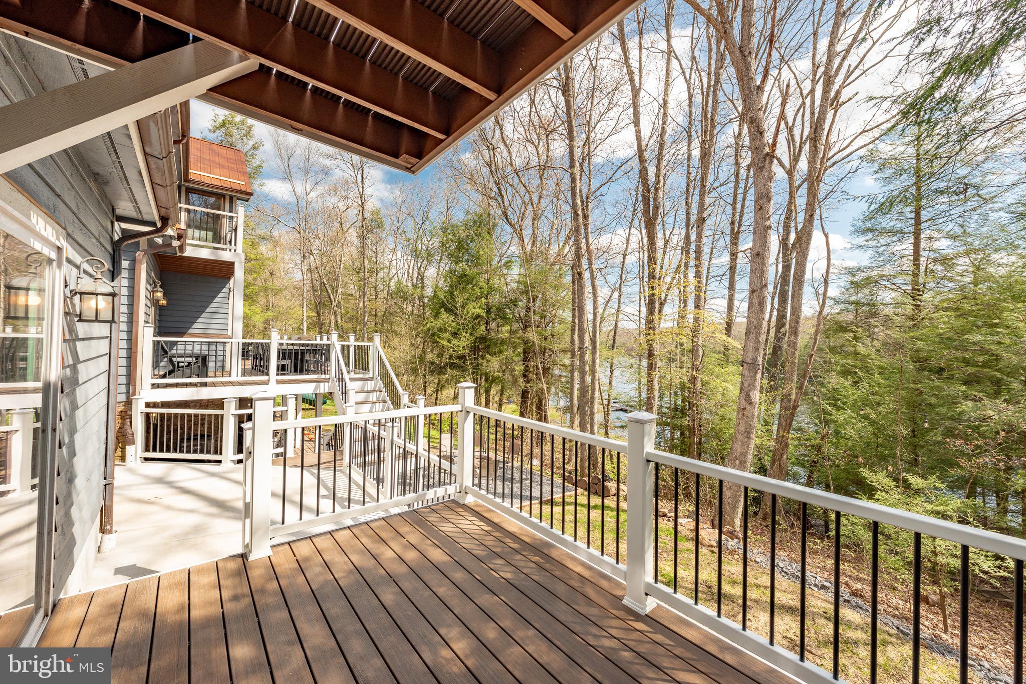 2463 Mayhew Inn Road Oakland, MD 21550 - Photo 88 of 144 a view of a balcony with wooden floor and fence
