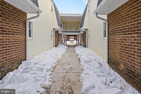 a view of a pathway with a patio