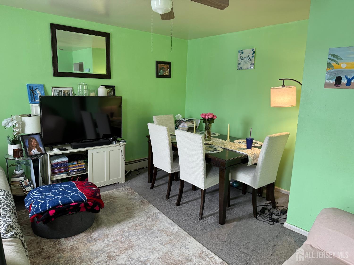 31 Edwin Street Carteret, NJ 07008 - Photo 17 of 18 a living room with furniture and a flat screen tv