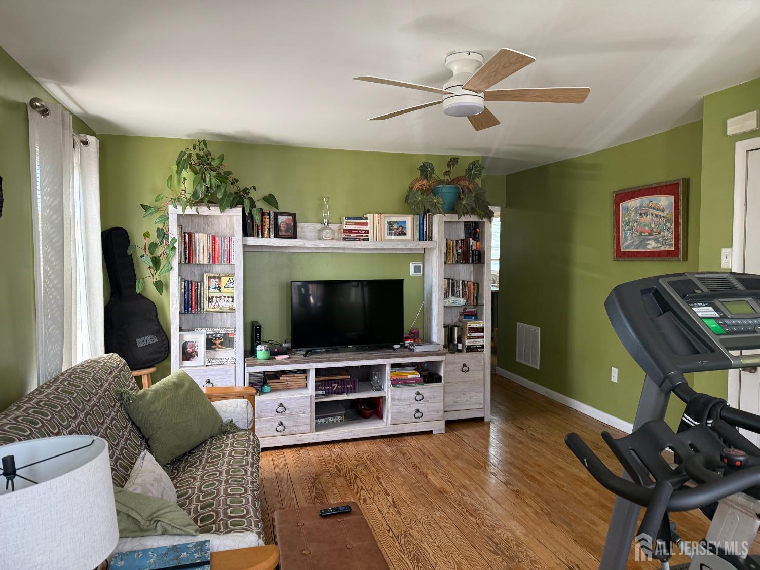 31 Edwin Street Carteret, NJ 07008 - Photo 3 of 18 a living room with furniture and a flat screen tv