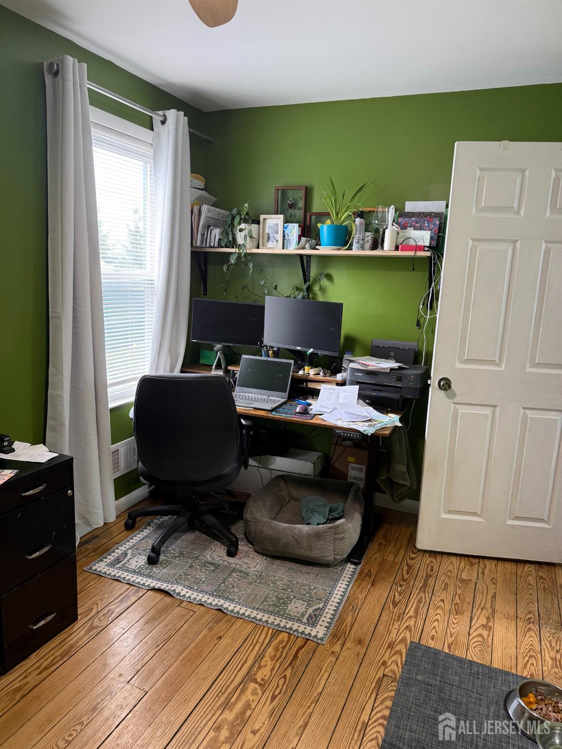 31 Edwin Street Carteret, NJ 07008 - Photo 5 of 18 a work room with furniture and wooden floor