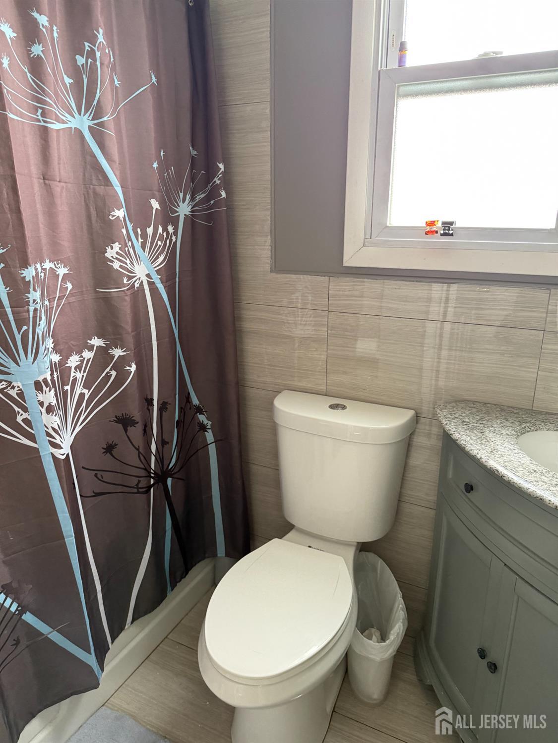 31 Edwin Street Carteret, NJ 07008 - Photo 6 of 18 a bathroom with a toilet and a shower