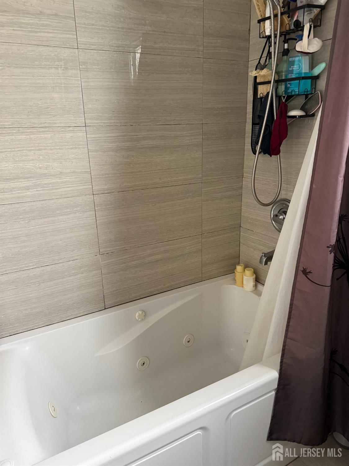 31 Edwin Street Carteret, NJ 07008 - Photo 7 of 18 a bathroom with a bathtub and shower