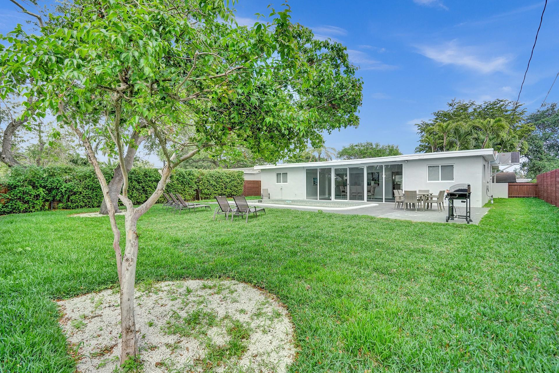 2114 North 42nd Avenue Hollywood, FL 33021 - Photo 24 of 24 a view of a house with a backyard and a patio