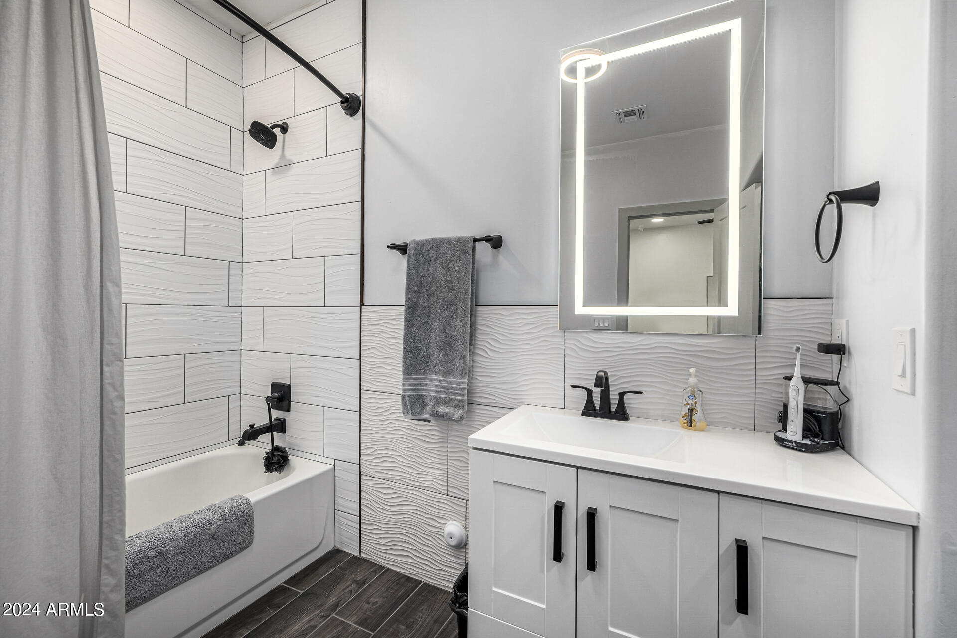 1829 West Cloud Road Phoenix, AZ 85086 - Photo 50 of 137 a bathroom with a sink a mirror and shower