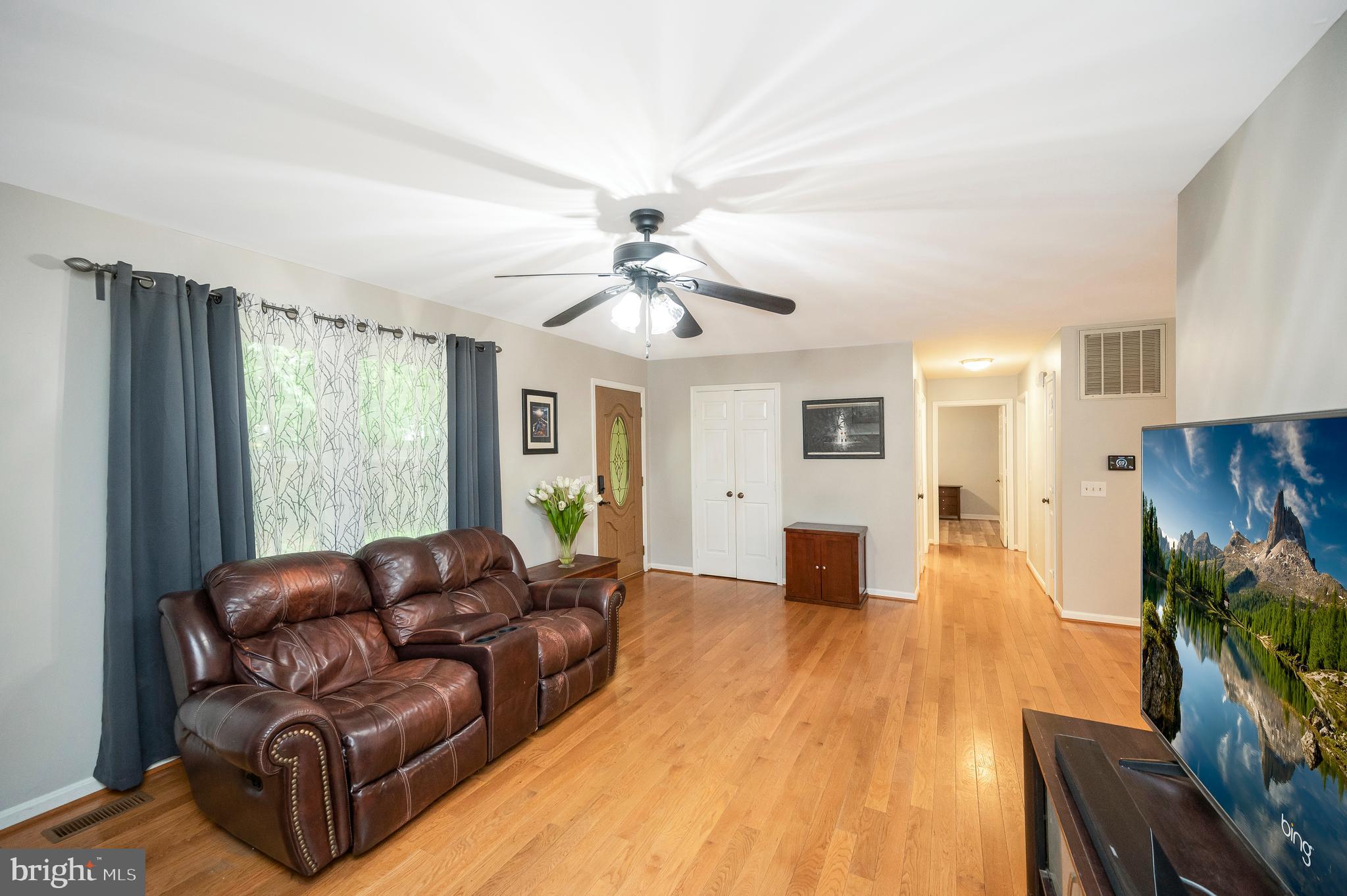 679 Cropp Road Fredericksburg, VA 22406 - Photo 7 of 39 a living room with furniture and a flat screen tv