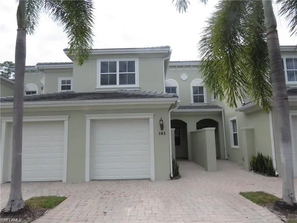 a front view of a house with a garage