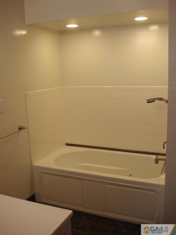 198 Opossum Road Skillman, NJ 08558 - Photo 17 of 25 a bathroom with a bathtub and a shower