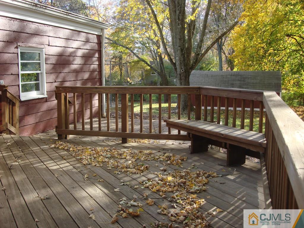 198 Opossum Road Skillman, NJ 08558 - Photo 21 of 25 a view of a wooden deck with a bench