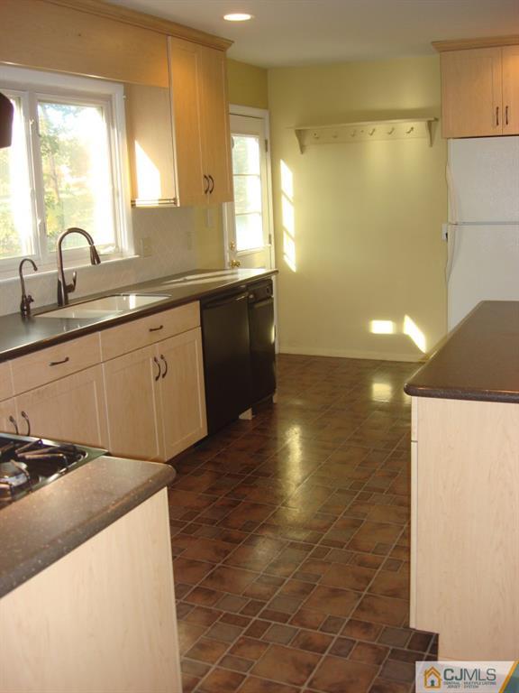 198 Opossum Road Skillman, NJ 08558 - Photo 7 of 25 a kitchen with stainless steel appliances a sink and a stove