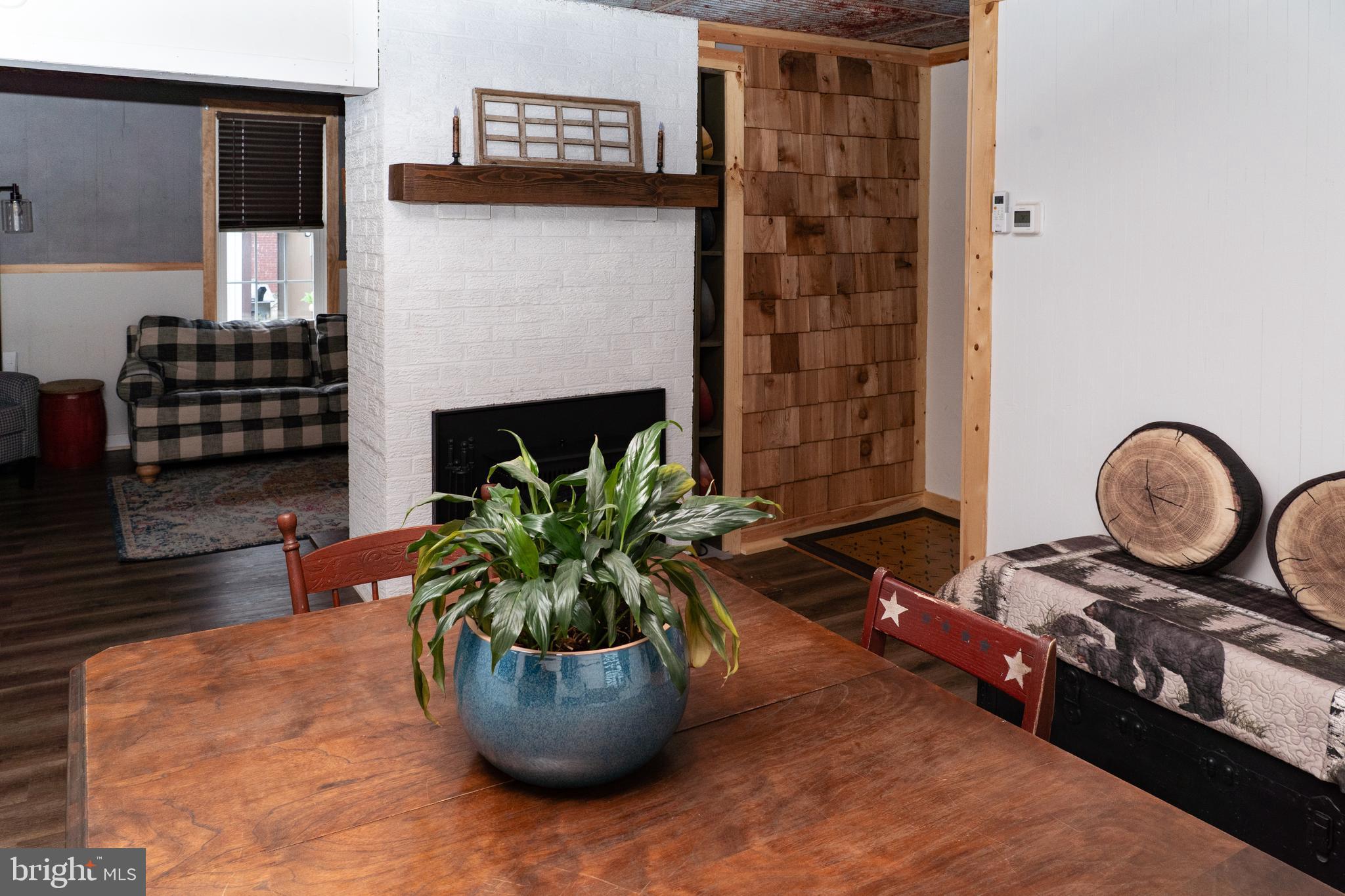 420 Locust Street Burnham, PA 17009 - Photo 12 of 59 a living room with furniture a potted plant and a fireplace